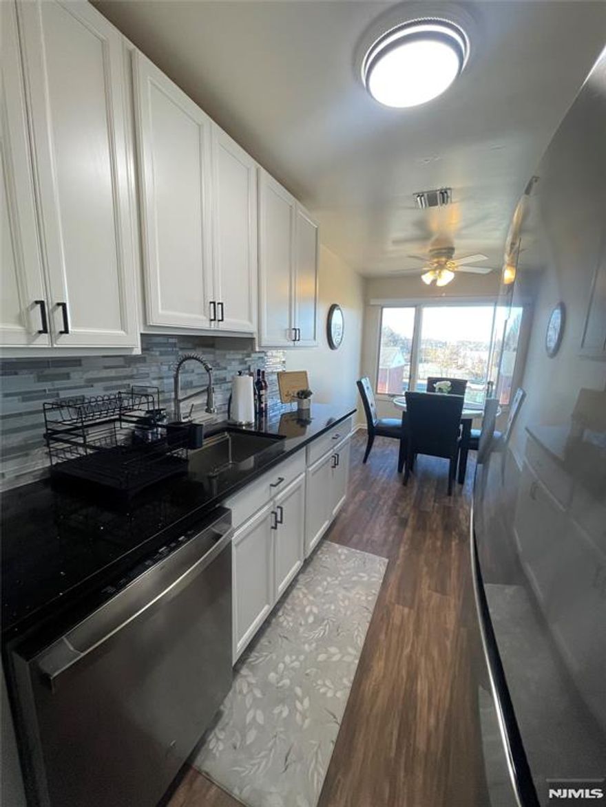 Spacious and sun-filled condo offering exceptional features and recent upgrades. Step into a beautifully updated home featuring a brand-new kitchen with ss appliances, central air, and a spacious living room with a working fireplace, all within an open and airy layout. The generously sized primary bedroom boasts an impressive closet, while the open loft provides versatile space, ideal for a second bedroom, home office, or den. Enjoy ample closet storage throughout, in-unit laundry with additional storage, and assigned parking. Major updates include new heating and cooling systems with a NEST thermostat installed in 2023 and new flooring completed last summer. Ideally located just one short block from NYC bus transportation and close to shopping, dining, and major routes. Situated in the desirable Evergreen Court complex. Pet-friendly! Located in the sought-after town of Little Ferry, NJ. Donâ€™t miss this opportunity, this gem wonâ€™t last.