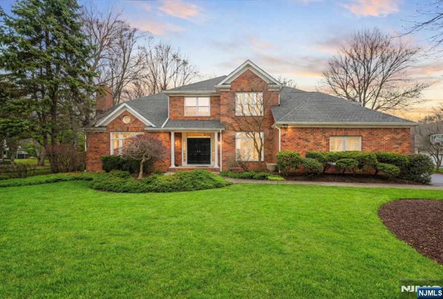 Hurry! Homes in this sought-after neighborhood are selling quickly & this exceptional colonial is no exception. Located in a desirable sidewalk-lined neighborhood, this stunning home welcomes you with a grand two-story foyer & a beautifully designed open floor plan. The main level features a private office, elegant formal living room with a picture window and fireplace. An archway leads into the dining room with easy access to the kitchen. The gourmet eat-in kitchen is perfect for entertaining & everyday living, offering high-end stainless steel appliances, custom cabinetry, a desk area & a large center island with seating. The bright breakfast area opens through sliders to a paver patio & flat fenced yard, ideal for outdoor gatherings. Family room boasts a second fireplace & oversized windows that fill the home with natural light. A laundry & mudroom complete the main level. Upstairs, the primary suite features a tray ceiling & custom built-ins. Don't forget about the updated spa-like bath with a soaking tub, large shower & dual sinks. Four additional bedrooms offer generous space, including one with a cathedral ceiling & another oversized bedroom with a walk-in closet & storage. The finished lower level provides additional living space with a family room & flexible area ideal for a game room or gym. Walking distance to Lake Valhalla, this community is known for its prime location and convenient access to major highways.