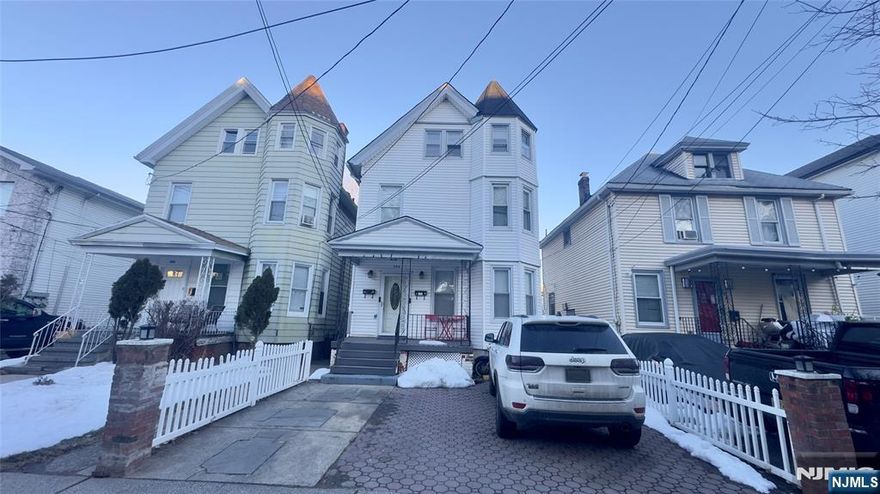 Great investment opportunity or perfect owner-occupied home! This well-maintained 2-family property offers spacious layouts in both units. The 1st floor features a living room, dining room, kitchen, 1 bedroom, 1 full bathroom, hardwood floors, and access to a deck. The 2nd floor includes a living room, dining room, updated kitchen, 3 bedrooms, and 1 full bathroom. The finished basement provides additional living space with a family room and office. Separate utilities for each unit. Conveniently located near transportation, shopping centers, and schools.