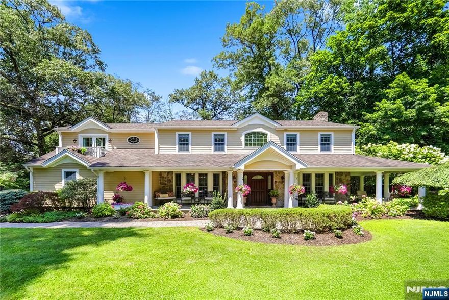 Location, location, location...discover an exquisite CH colonial home nestled amidst lush grounds on Woodcliff Lake's premier street in the prestigious "Hill" section. A stately bluestone front porch welcomes you into a grand, foyer, flanked by formal dining & living rooms-boasting a large fireplace, detailed millwork, & floor-to-ceiling windows. The impressive, open kitchen is a chef's delight, equipped w/top-tier appliances: Viking dbl wall ovens, Wolf cooktop, Sub-Zero refrigerator, & a center island w/seating & prep space. The kitchen seamlessly flows into a sun-drenched breakfast room w/a wall of glass, & into a dramatic great room featuring a vaulted ceiling, another striking wall of glass, & French doors leading to the patio & lush grounds. The first-floor spacious office, additional BR & full bath complete this level. Retreat upstairs to a stunning primary suite, a private oasis w/a lrg lounge area, private balcony, & a generously sized outfitted WIC. A dedicated makeup vanity w/sink adds convenience. The spa-like primary bath indulges w/a dbl vanity, jetted tub, fireplace, lrg shower, & water closet. 2 additional BRs share a Jack & Jill bath, bedroom, hall bath, laundry & double linen closet. The lower level offers casual entertaining w/a rec rm, glass-enclosed gym, full bath, & BR. The lush grounds feature a rear paver patio. Come fall in love w/this unparalleled home â€“ where every detail speaks to luxury, superior craftsmanship, comfort, & sophisticated living!