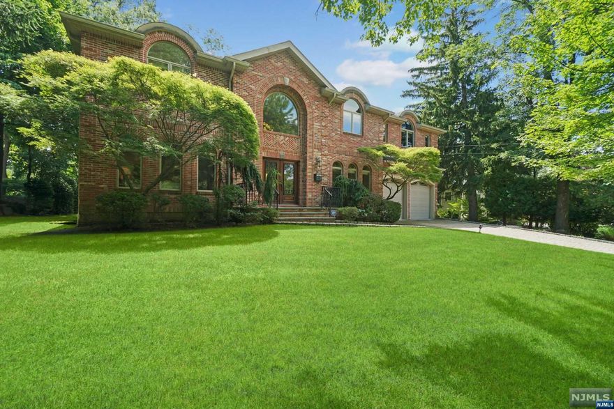 HIGHEST & BEST DUE TUESDAY 8/22 BY 4PM. Introducing an exceptional brick estate w/incredible detail t'out.This stunning home offers unparalleled luxury & comfort, boasting 5 BRs, 6.1 bths & over 5,500 sqft of living space across 3 flrs. Grand room sizes w/high ceilings & oversized windows are flooded w/nat light. A regal 2-story EF w/Marble fls & wrought iron doors open to the ideal 1st fl layout ft HDWD flrs & custom moulding. Gracious sized DR & LR, gourmet EIK ft Wolf & sub-zero appl, center island & butlers pntry are made for entertaining.EIK is open to bright FR w/herringbone fls & fpl w/views of the BKYD.1st fl BR/office w/full bth, mdrm w/PR & access to garage add conv. 2nd fl boasts grand prim suite w/vaulted ceilings, sitting area, his/her WIC & spa-like bth. Addl 3 expansive en-suite bdrms w/lrg windows, fitted WIC's & ldnry rm complete this level.LL offers addl living spaces w/lrg rec area, full wet bar, office/bonus rm & egress window for easy 6th BR.Private flat BKYD.
