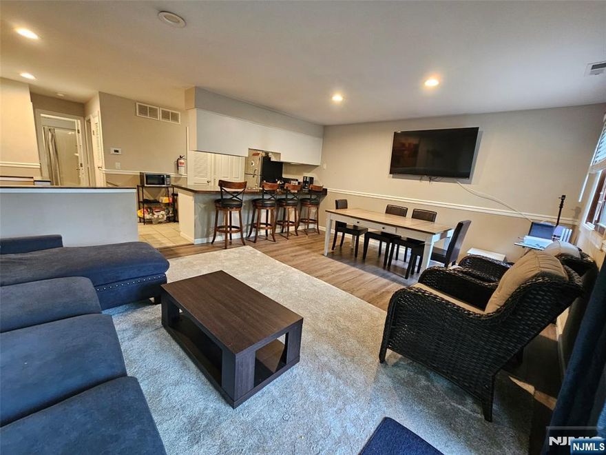 wonderful open flr pln end unit with multiple decks and short walk to slopes! Entire unit updated in 2019! Plank flooring throughout for EZ maintenance. Tile flrs in Kit, bths. New sliding doors to deck and patio. Minimum steps to main level deck with sitting area. Enter to open floor pln with modern kit, large butcher blk peninsula with seating. SS appliances, nice sized deck accessed from LR. Recessed lighting for bright atmosphere. Stackable W/D, full bth with tub/shr, pantry and BR 1 complete main level. Lower level offers a lg fam rm with a full wall of closet space, a full bth w stall shr, and large BR with access to patio. Patio is on grade level for EZ access to yard and walk to slopes. Assoc pool is available from May to Sept. Perfect for full time yr round enjoyment or weekend getaways. Area offers Mtn Creek Resort, Minerals and Crystal Springs, quaint villages, breweries, wineries, orchards, music, golf, state parks, Appalachian Trl, and so much more!