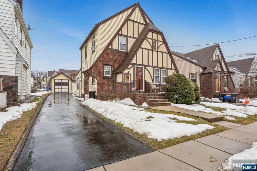 Beautiful Tudor-style home in Belleville offering Classic charm and modern comfort. This move in ready property features 3 spacious bedrooms, 2 full bathrooms, perfect for comfortable living, ample driveway and garage, finished basement and much more. This home showcases timeless Tudor architecture with a brick and stucco exterior, steeply pitched rooflines, and distinctive decorative trim. Inside, you'll find a beautiful, decorated interior that feels warm, inviting, and well maintained throughout. The home is truly turnkey- just unpacked and settle in.