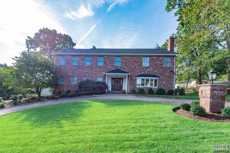 Welcome to this meticulously renovated & well maintained 5 bedroom, 3.5 bath colonial in desirable Hawthorne Heights! This impressive home has it all including NYC views and an outdoor oasis w/ pool, custom bar & multiple decks. Upon entering, you will be greeted by a 2 story entry foyer, living room w/ wood burning fireplace, dining room, gut renovated kitchen open to large family room w/ 2nd fireplace and a convenient 1st floor primary suite. The 2nd level offers another oversized primary suite w/ sitting area, cathedral ceiling, walk-in closet, stylish bathroom w/ double sinks & spectacular views from every window. There are 3 additional bedrooms plus a renovated hall full bath w/ detailed tile work & custom vanity. Additional features include a finished lower level w/ half bath & 2nd laundry room, alarm, sprinklers, hardwood floors, 5 zone hot water baseboard heat, 2 zone central AC, oversized 2 car garage, new deck w/ motorized awning, paver circular drive & much more!