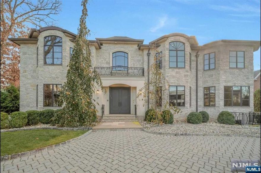 This luxurious 6-bedroom, 7.5-bath home in Englewood Cliffs showcases top-tier craftsmanship. Built by a leading local builder, it's move-in ready with custom inlaid ceilings, a high-end Alno kitchen with Viking appliances, and a walk-in pantry. The first floor also includes an ensuite bedroom and 3-car garage access. Upstairs, there's a primary suite with large walk in closet, three more bedrooms, and a laundry room. The lower level offers a gym, home theater, wet bar, and great room with a fireplace. An elevator connects all floors, and the backyard with outdoor kitchen. Located on the North Cliff of Englewood Cliffs and just 5 miles from the GWB.