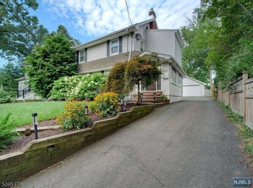 Just one block from the entrance to Brookdale dog park, this lovely 4 bedroom with finished basement will have you fall in love. From the hardwood floors to several WICs, open bright skylight lit kitchen to the private back deck. The beautifully matured hydrangea bushes to the comfortable lower level space to the warm thoughtfully done large baths, this space could be your Montclair "happy place". Features hardwood floors throughout, a smart front sunroom, easily used as an office and a well done third floor bedroom with side built ins and office or Peloton room extension, for a feeling of a separate suite. Purchase includes peace of mind from the included Cinch home warranty. Be settled just in time for the first weeks of school! Square footage sourced from tax record.