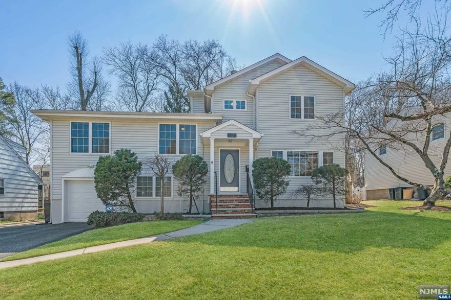 Nestled on a quiet street near the heart of Ridgewood's downtown, this sunny home in the sought-after Somerville district offers the best of both worlds: close enough to be part of all the action, yet all the feels of a private retreat complete with a resort-like pool & an updated, expansive Primary Bedroom ensuite. Accented by chic new light fixtures, the airy open concept Living/Dining/Family Room with Breakfast Bar showcase views of the backyard oasis. All Bedrooms with large closets, Full Bathrooms & Laundry Room located upstairs make this an ideal layout. Primary ensuite with vaulted ceilings & Palladian Windows hosts spacious Walk-in Closet, Boudoir/dressing area & Newly Renovated Primary Bathroom with double sinks & oversized tiled shower. With almost 2500sf above-grade living space, lower levels include Workout/MudRoom area, Powder Room, & Rec Room/ Play Room. New A/C Unit & Water Heater. Prime location near Dunham Trail, NYC transportation & all downtown has to offer!