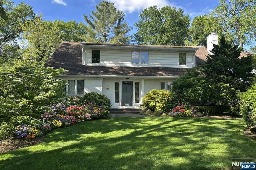 Gracious 7-bedroom, 5 full bath colonial on approximately 1/3 acre in W Englewood section of Teaneck. 25 ft grand living room with fireplace, 2 story height Great Room, Master suite with adjoining office on first floor. Basement has bedroom with guest suite. 2 car garage. Easy access to House of Worship, parks and transportation.