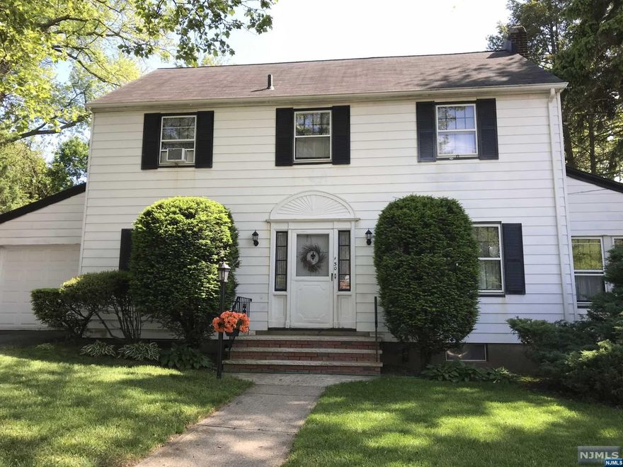 Beautiful Center Hall Colonial with oak floors, high celings large sunlit living room with fire place. Lovely den, large formal dining doom, Eat in Kitchen, 2nd Floor huge primary bedroom (room for full bath), 2 more lovely bedrooms, updated bathroom. Pull down attic, full unfinished basement with walkout stairs to rear yard. Double driveway, fenced side yard, attached garage. Close to parks, schools, shops and NYC busses.