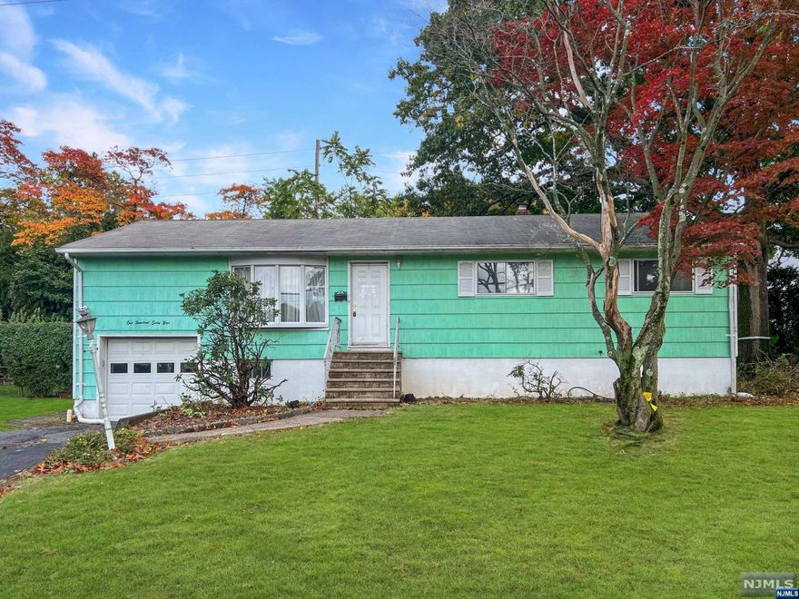 The object of your desire can be found in Dumont! Beautiful Bedford Ravishing Ranch awaits its new owners. Delightful Fabulous Fifties home sits on a wonderful street and level lot just across from the Park is the perfect place to pitch your flag. Main level features include a bright and spacious formal living room that opens to the lovely dining room and its wonderful wall of windows. Well-designed and proportioned kitchen has access to both the dining room & living room. Majestic Master Bedroom has great closet space as well as a half bath for privacy. Two additional bedrooms and full bath round out the main level. Lower level is partially finished with expansive recreation room that features a timeless bar as well as storage, laundry, and the utilities. Additional finished room over the garage is perfect for an office or playroom. Oversized deck is the focal point of the quaint and private backyard. Home needs some vision and ideas but there are great bones to start! See today.