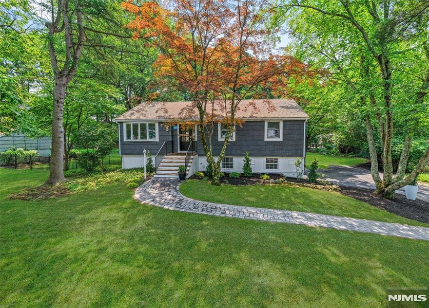 Highest & Best offers are due Thursday, June 19th @ 1pm. Welcome to this stunningly renovated Ranch! Off the entryway, youâ€™ll be greeted by gleaming hardwood floors & craftsmanship evident in every detail, from the moldings to the beautiful fixtures. A spacious living room flows seamlessly into the open-concept kitchen & dining area with high ceilings. The custom kitchen with high-end cabinetry, new appliances & Taj Mahal countertops make it a chefâ€™s dream. Step out to a covered porch overlooking a private yard, perfect for relaxing or entertaining. Down the hall is a luxurious primary suite with a designer bath, plus two additional bedrooms & a beautiful full hall bath. The walkout lower level surprises with a large family room, patio access, huge 4th bedroom & another full bath, perfect for extended family or guests. Every detail has been carefully designed. All of this sits on a 145 x 100 lot that is flat & private. Enjoy one-floor living, space & luxury, all just moments from downtown Ramseyâ€™s shops, restaurants, trains & schools! WANT MORE INFO? CONTACT LISTING AGENT NICOLE MINETTI @ 201-388-0077/nicole@minettidennisgroup.com