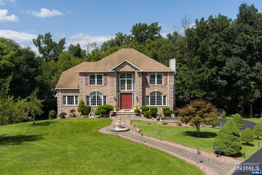 Call Joseph c.201-927-1461. Welcome home to Hardyston Township! Custom-built colonial, with 3 gazebo styled rooms. Located on a private cul-de-sac in Timberline Manor, on nearly 2 acres. Oversized two-story foyer with sweeping dual staircases and imported Alabaster stone chandelier. Formal dining and living rooms. To the rear is the kitchen, family room, and dinette leading to the private deck. The first floor also features an office/flex room, powder room, laundry room, walk in pantry, and custom made columns. Situated upstairs are 4 nicely sized bedrooms, a full bathroom, attic access, plus a very generous primary suite with large walk-in closet, sitting area, and an oversized ensuite bathroom. Walkout basement is fully finished with custom bar & cabinetry, full bathroom, built-in seating, garage access and wall-to-wall storage closets. Exterior gutter guards, a newly paved driveway, paver stone walkway w/patio sitting area, functional fountain, fruit trees, and large yard