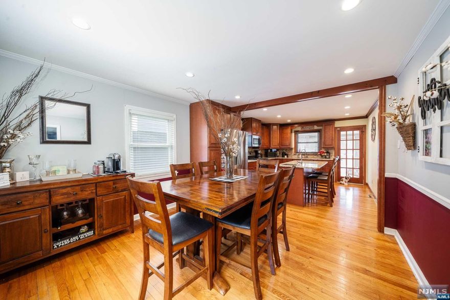 Discover the charm of this beautifully updated Cape Cod nestled in Kearny's esteemed Manor section, within the Roosevelt school district. This 1,900 sq. ft., 3BR/2BA gem boasts modern updates: a sunlit open-concept kitchen with stainless appliances, stone countertops, dual sinks, and gleaming hardwood floors throughout. Relish its bright ambiance, a result of plentiful windows. Enjoy outdoor delights: a wraparound 3-tier deck, sparkling pool, and gazebo-adorned grassy area, perfect for summer gatherings. Inside, a spacious bedroom boasts a walk-in closet and a double-showerhead bathroom. The enclosed, window-rich porch overlooks the pool, ideal for entertainment. Upgrades include a new roof, central AC, and a 200 Amp electrical service. Partially finished basement offers additional space with a separate entry. Located conveniently near city-bound bus routes, this home combines tranquility with accessibility. Experience the allure of 57 Terrace Place.