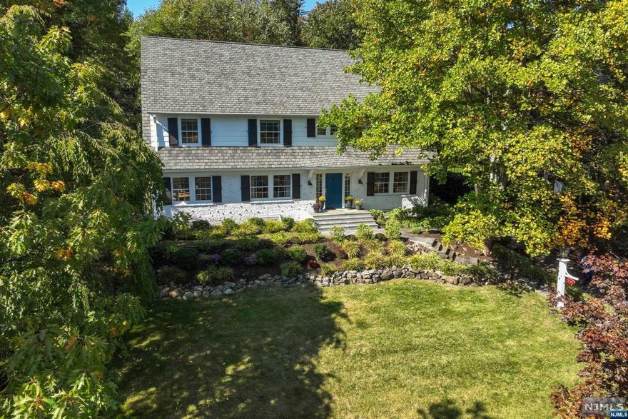 Located in the highly-coveted Estate Section and perched high on South Mountain Ave facing NYC, this sun-drenched, classic Center Hall Colonial won't disappoint! A gracious entry foyer is flanked by a beautifully scaled living room with fireplace & dining room. A true chef's kitchen with a large center island, quartz counters/backsplash, Wolf range, Sub Zero refrigerator & a breakfast area with fireplace where everyone can gather for the holidays. A sun-filled family room, home office, powder room, and mudroom complete the 1st floor. Upstairs offers an exquisite primary bedroom with spa-like ensuite bath, 3 additional corner bedrooms, 2 full baths & hall laundry. Third floor has 2 more ample bedrooms, an office or additional bedroom if needed, and a hall bath. Lower level features a finished rec room, temperature controlled wine cellar, laundry room, and powder room. The outdoor terraced bluestone patio with an inground pool and waterfall makes for amazing entertaining! INTERIOR