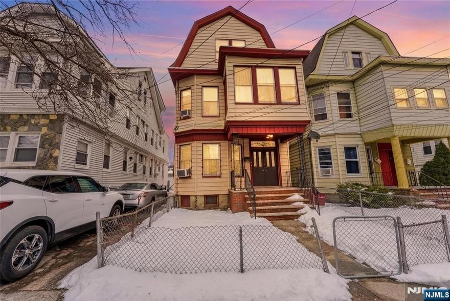 This legal two-family home features 8 bedrooms and 3 full baths on a quiet Newark street. The first and second floors each feature three bedrooms, an eat-in kitchen, and a living room. The third floor provides two bedrooms, a kitchen, and a living area. Move-in ready with hardwood floors and forced-air heating. The home is just steps from local schools, parks, shopping, and public transportation. With immediate access to NJ Transit bus routes, I-78, and Newark Penn Station, this gem delivers unbeatable convenience and value for both owner-occupants and investors.