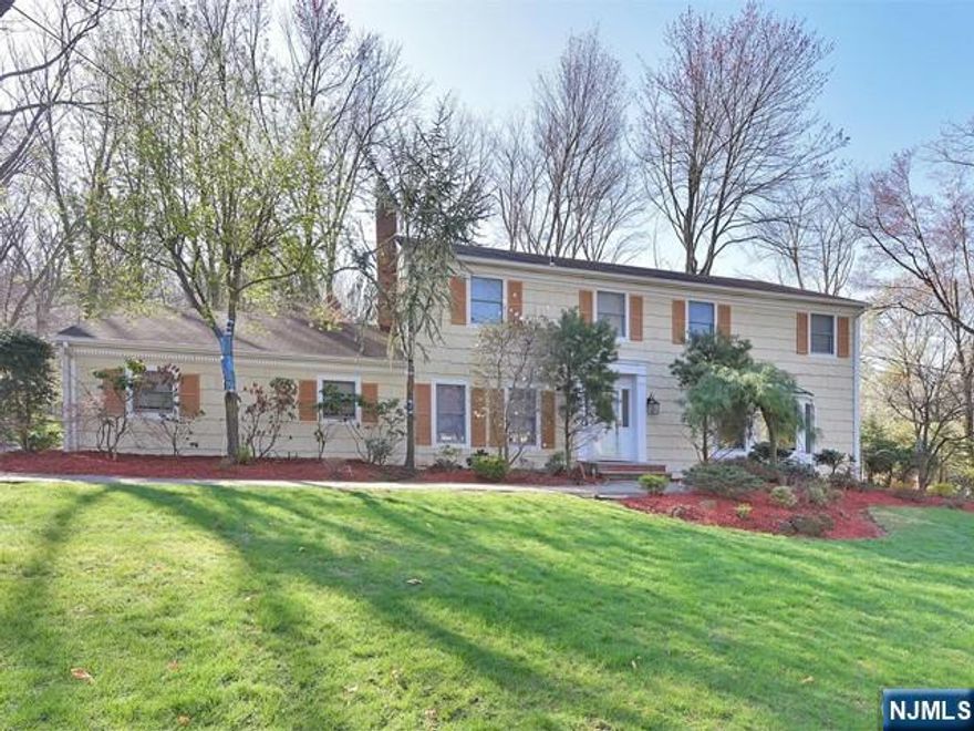 This beautiful traditional center hall colonial is set on an acre in Norwoodâ€™s prestigious East Hill. Nestled on a corner lot in a private cul-de-sac, this 5-bedroom, 3.5-bath home has it all.Features include a kitchen with Viking appliances, new refrigerator, and more; a contemporary living room with a wood-burning fireplace; a family room with finely crafted built-ins; an elegant dining room; and a mudroom and powder room leading to a spacious, modern eat-in kitchen.The kitchen opens to a huge, beautiful deck overlooking a lush one-acre property. The second floor boasts a primary bedroom with a large walk-in closet and en-suite bath, four additional spacious bedrooms, two full bathrooms, and hardwood floors throughout.A stair lift is installed for convenient access between floors.The fully finished basement offers a large gym, playroom, full bath, and ample storage. Additional features include a security system, sprinkler system, and an HVAC system. A rare opportunity-A must see