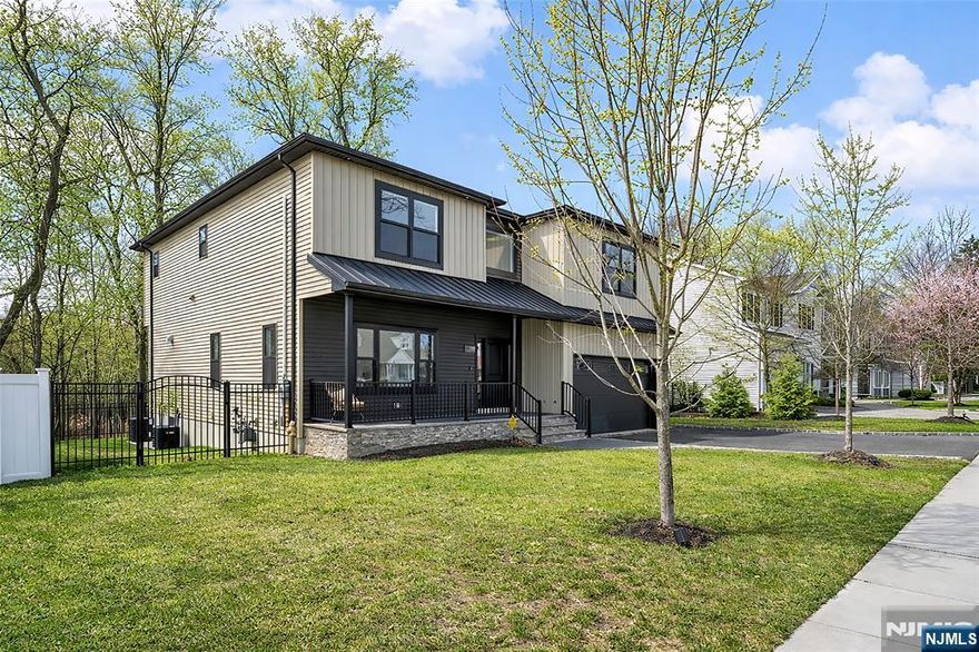 MODERN LUXURY & SMART DESIGN | 4,000+ SQ FT NEW CONSTRUCTION Experience the pinnacle of suburban living in this stunning 4BR, 3.5BA Colonial, custom-built in 2023. Boasting 4,000+ sq ft of meticulously designed space, this home blends high-end finishes with everyday functionality. The sun-drenched, open-concept floor plan features soaring ceilings and a gourmet chefâ€™s kitchen w/ quartz counters, massive island, and premium black stainless appliances. Upper level features a primary suite sanctuary with WIC and spa-like bath, plus convenient 2nd-floor laundry. The standout lower level offers a full bath, and sleek wet barâ€”perfect for a home office or just premier entertaining. EV-charger, 2-car garage, 2-zone HVAC, and security pre-wiring. Huge 1.44-acre lot borders a 6-acre protected conservation preserve for permanent privacy. Walking distance to Woodside Elementary & Holdrum Middle; attend acclaimed Pascack Valley HS!