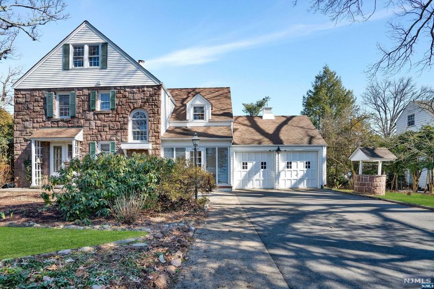 Designed by renowned architect Carl Kemm Loven and built by Reynen, this lovely home features steel beam construction and original hard wood floors on all three levels. Nestled in a wonderful neighborhood and just blocks to town and transportation, this home is perfect for any size family. A sunny eat in kitchen overlooks the large private side yard with slate patio. Generously sized rooms, 4 bedrooms, 3 full baths, and a 2 car attached garage, make this your forever home! The lower level with wet bar and high ceilings is ideal for your creation of an entertainment center. Enjoy the proximity to vibrant downtown and Ridgewood's top rated school system!