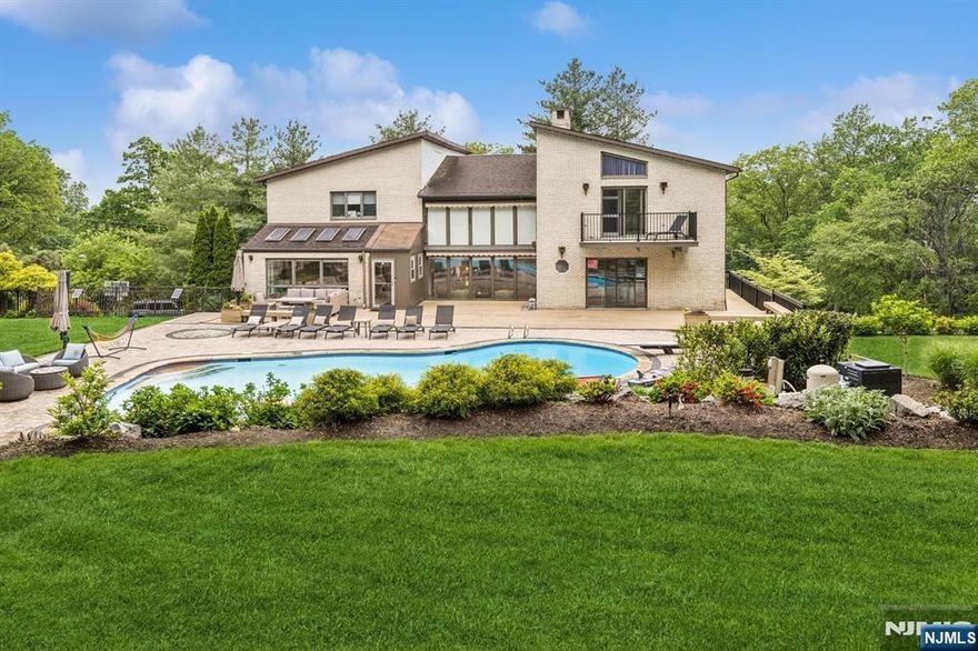 Elegant and spacious home with versatile layout and luxurious amenities. Main floor features a welcoming entry foyer, formal living room, family room with double-sided fireplace, formal dining room, eat-in kitchen, a bedroom/office, and a full bath. Upstairs offers a serene primary suite with fireplace, private terrace, and spa-like bath, plus an adjacent office. Three additional bedroomsâ€”one with en-suite, two sharing a hall bathâ€”complete this level (3 baths upstairs). Walk-out lower level includes a bar, full kitchen, rec room with fireplace, en-suite bedroom, guest bedroom, sauna, guest bath, laundry, storage, and garage access (2 baths). Enjoy a resort-style cabana with kitchenette, bath, shower, and changing rooms by the pool. 6 full baths in the home + 1 in cabana.