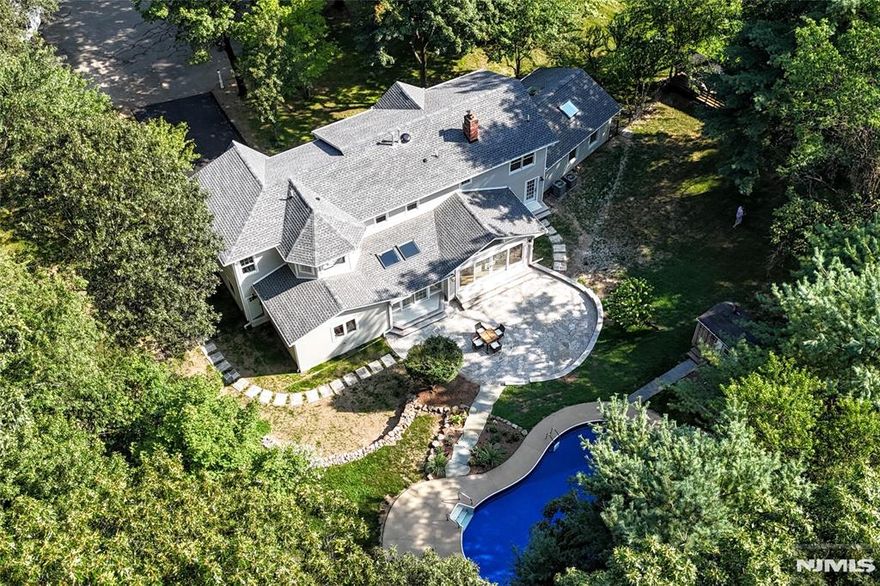 Welcome to this custom home on a quiet cul-de-sac along side the beautiful JA McFaul Environmental Center. Thoughtfully redone and expanded, top to bottom renovation on its original foundation, this residence offers the perfect blend of luxury, sophistication, tranquility, and privacy. Designed with high-end finishes throughout, the home is an entertainerâ€™s dream with a resort-style backyard featuring a heated inground pool, slate patio, BBQ area. Inside, abundant natural light fills every room showcasing a spacious great room with beamed ceilings, sitting area, formal dining, inviting family room, two fireplaces, and a breathtaking kitchen with Taj Mahal quartzite counters, panel ready appliances, hidden pantry with Costco door, and an oversized workstation sink. A mudroom, powder room, and full bath with direct pool access complete the level. Upstairs offers three generously size bedrooms, a stylish hall bath, laundry room, and a luxurious primary suite with sitting area overlooking the grounds, custom walk-in closet, and spa like bath. Enjoy all Wyckoff has to offer with top rated schools, low tax rate, and several shopping/dining options. All public utilities