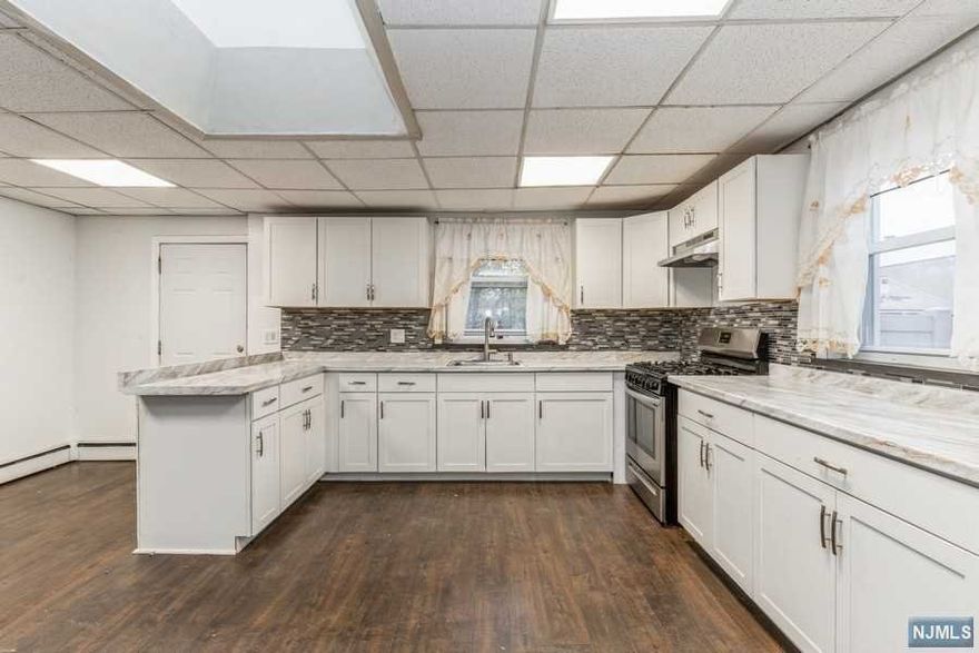 Take a look at this excellent,renovated,2 story,single family home located about 15 miles from NYC. 1st Fl. offers a large eat-in kitchen with new and updated countertops, lots of cabinet space, laudry area, new waterproof flooring, living room, and a renovated full bath. 2nd Fl. boasts 2 decent sized bedrooms, and a full updated bathroom. The finished basement provides extra living space excellent for recreational purposes, or storage.The new paved driveway can easily fit at least 12 cars.This amazing home sits on a large lot with a new privacy fence for its enormous yard.Close to train station, bus stop, turtle back zoo, and about a half hour to Newark airport or John F Kennedy international airport. You want to be close to a hospital? You have a couple choices within 10 minute drive. You need entertainment? AMC DINE-IN, Bars, restaurants are at walking distance.Need conveniency? You get it all here and more! Make an appointment today to see all of what this home has to offer.