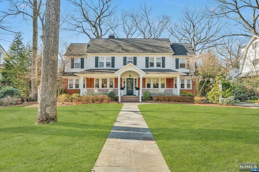 Welcome to this distinguished and inviting Ridgewood Center Hall Colonial, located in the sought after Heights neighborhood on Sunset Ave, one of Ridgewood's most coveted streets.Blocks from downtown, NYC transportation, Ridge Elem. and GW MS. Set on nearly a half an acre of private and prof. landscaped property w/over 7000 SF of impeccably maintained and thoughtfully renovated sophisticated living space. This home will satisfy today's most discerning buyer. An impressive addition includes a handsome Fam Rm w/soaring ceiling & stunning architectural windows overlooking the expansive yard. A magnificent and sun drenched classic kitchen will impress,white subway tile, Calacatta gold counters,TOL appliances & custom built-ins.Great functional space flows through a desk area, MudRM,lndry,PR,and around to the elegant DR, LR and office w/classic glass French drs all tastefully appointed. 5Bdrm,3 FB,2HB.Your family will enjoy the spectacular basement. FH Generator, truly exceptional!