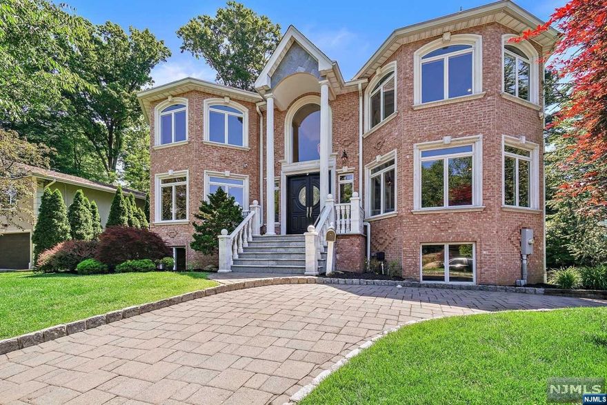 All brick, quality-built colonial house with beautiful trimming work through the house. Newly painted and finished floor. First floor features 2-story entry foyer leads to 2-story family room with magnificent fireplace. Beautiful kitchen with stainless Wolf/Subzero/Viking appliances. Kitchen connects to breakfast area with sliding door to the backyard. Formal dining room with large window. First floor also has living room, study/office, AND bedroom with full bathroom, perfect for extended family. Second floor features huge master suite with his and her walk-in closets. Master bath has jacuzzi tub and large shower; Three additional bedrooms with full bathrooms on 2nd floor. Fully finished basement with large open area, and additional bedroom and full bath. Central AC and baseboard heating system. Radiant heat in foyer, kitchen, and master bathroom.