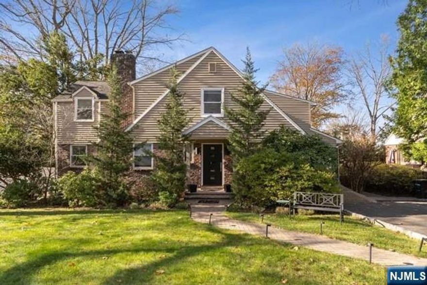 Beautifully renovated and expanded, this 5 bedroom 3.5 bath home offers bright, airy living throughout. The main level features large windows, a spacious family room with fireplace, and an oversized kitchen and dining area designed for entertaining. The kitchen includes a large island, abundant cabinetry, and updated appliances. Sliding doors lead to a Trex deck and a landscaped, fully fenced backyard. A mudroom off the attached garage, a first floor office or den, and a powder room complete this level. Upstairs offers three bedrooms, a full bath, and a serene primary suite with a walk-in closet and updated bathroom. The finished basement adds incredible flexibility with a large recreation area, laundry room, an additional bedroom with a full bath, and a bonus room perfect for an office or gym.