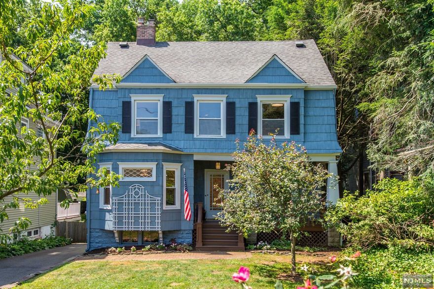 Picture perfect, updated colonial with 4 bedrooms,1.5 baths, natural hardwood floors, central air, a welcoming front porch, and a two-tier deck overlooking nearly 1/2 acre of park-like backyard! With gorgeous craftsman molding detail, a foyer leads to the spacious living room and sunlit dining room w/ lead glass windows and a decorative fireplace. Enjoy the large primary bedroom adjacent to a much-coveted dressing room/closet!! The third floor offers a home office, another bedroom, skylights, and plenty of storage! Newer Roof 2014, Furnace 2020, and AC 2021. Freshly painted exterior 2022. Located on the Glenridge/Bloomfield border just one block to either the Jitney to NYC Trains or Decamp Bus. Welcome Home!