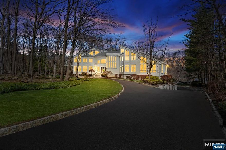 Wake up each day to breathtaking lakefront views in this striking modern home, set within the gated Smoke Rise community on one of its most coveted streets. Defined by walls of glass and clean architectural lines, the home is designed to maximize natural light and a seamless connection to the outdoors. Live and entertain with ease as the home offers: a dramatic great room with soaring ceilings, multiple living spaces, a chefâ€™s kitchen with high-end finishes, and access to a rear deck overlooking the water. The lower level features a custom theater, recreation space, wet bar, fitness area, and walkout to the backyard. Outdoors includes a newly installed pool, sunken fire pit overlooking the lake, and curated landscaping. The setting, lifestyle, and location make this home one of a kind. Schedule your private tour today.