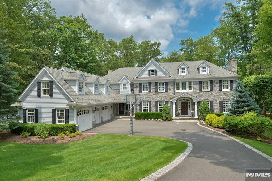 Elegant colonial showcasing intricate and refined woodworking and detailing throughout. Nestled on over 2.5 acres, the property features a free-form Marson pool with waterfalls, full service cabana, veranda, patio, firepit, 3 car garage and expansive, lushly landscaped grounds. A front-to-back marble foyer leads to a picture-perfect loggia overlooking the grounds, situated between the library and kitchen. The primary suite with fireplace and luxury marble bath and 2 walk-in closets offers exceptional views of the property. The media room (5th bedroom) is very large and versatile for guests or extended family. The lower level provides additional living space, perfect for workouts and relaxation. Two offices on the first floor are ideal for today's lifestyle. This very special residence is situated at the end of a prime cul de sac.