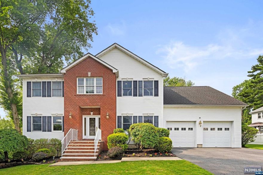 Seize the opportunity to own this meticulous updated center hall Colonial featuring 5 bedrooms, 4 baths, plus finished basement, & 2 car garage. True pride of ownership personified, large updated kitchen w/ center island, a die for private master suite w vaulted ceilings & luxurious walk-in closet w/center island. Easy living open floor plan with guest bedroom on the 1st floor and 4 bedrooms on the second. Finished basement with guest room and bathroom. Huge trek deck outside and private fenced in yard with mature landscaping. Minutes from NYC bus stop and the Oradel train station. Nothing to do except unpack!