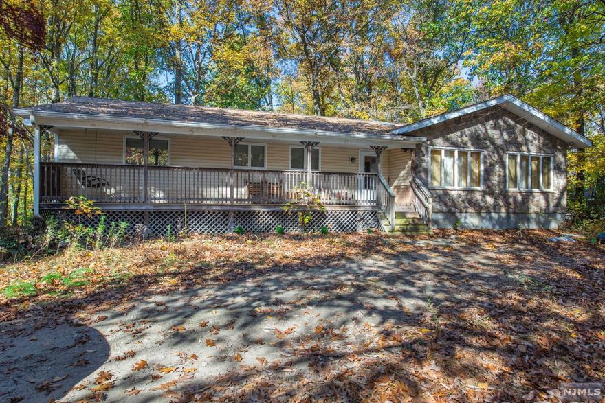 One Floor Living at this spacious Ranch! Features include Welcoming Front porch, 3 BR, 2 BA Plus 2 and 1/2 car garage situated on over 1.5 acres of Private wooded property. Features include EIK with center island and granite counters, MBR suite w-walk in closet, Family Room w-FP and glass sliders to large deck, Hwflrs, main floor laundry, Central AC and Central Vac System, expansive LL w-workshop area all ready to be finished with high ceilings and heat, LL walk out to garage. Newer updates: Bath, Roof, Pergo flooring, furnace, siding and garage doors. Natural Gas - 4 Zone Baseboard Heat. Close to shopping, easy access to highways, nearby parks & recreation, approx. 30 mi to NYC. Endless possibilities to make this home your own!