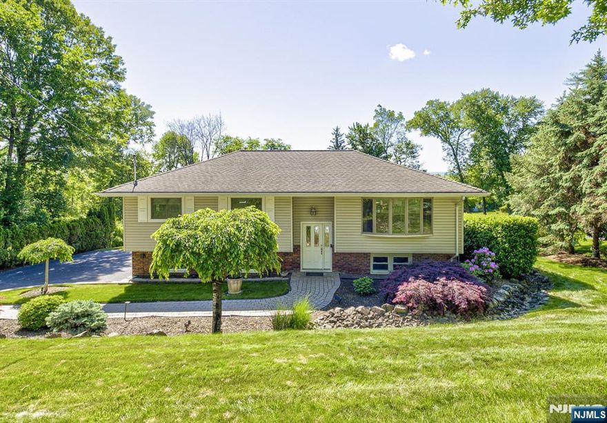 This beautifully expanded and meticulously maintained home is nestled on a serene cul-de-sac, offering an abundance of updates and stunning skyline views. The main level boasts a bright, open floor plan, starting with a spacious living room and formal dining area that seamlessly flows into the oversized kitchen the true heart of the home. Featuring elegant granite countertops, top-of-the-line appliances, and a convenient breakfast bar, the kitchen opens into a sun-drenched dining nook and cozy den. High ceilings, a wall of windows, and sliding doors to a Trex deck flood this area with natural light and provide breathtaking, panoramic views. The home also features four generous bedrooms with custom California Closets, two updated full bathrooms, and a large family room that leads out to a lovely patio and expansive, lush backyard. This exceptional property combines comfort and style in a peaceful setting.