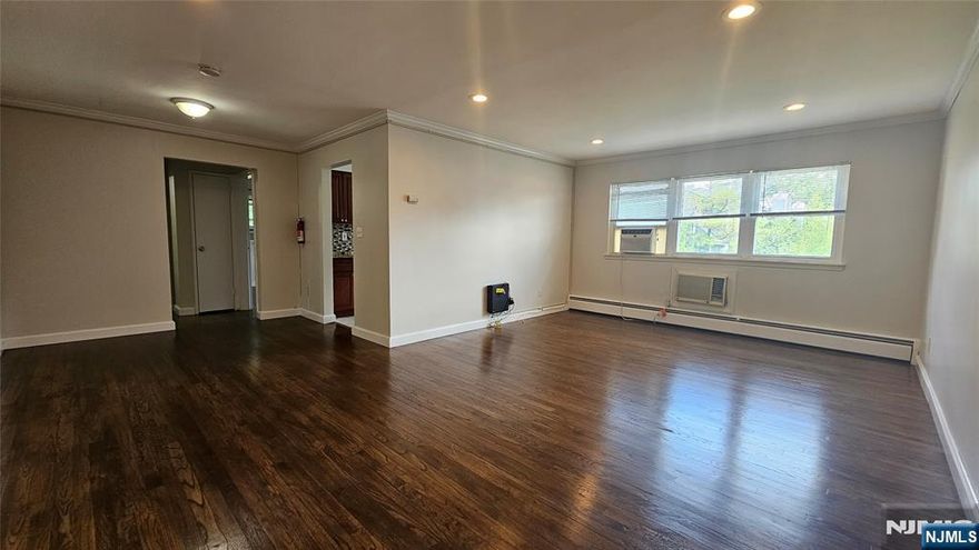 This beautifully maintained apartment offers the perfect blend of comfort and convenience. Enjoy a spacious, sun-drenched layout with hardwood floors throughout, an updated kitchen, and a modern bathroom. Commuters will love the easy access to NYC transportation, and you'll be just minutes from local shopping and top-rated schools. On-site laundry adds to the ease of living. Donâ€™t miss this move-in ready gem â€” schedule your tour today!