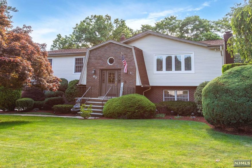 Your search stops here! Beautifully updated Bi-Level offer Multi Room In-Law-Suite,Nestled on a quiet road the first level consists of 6 year old Kitchen w/Center Granite Island,Stainless Appliances,separate dining area,French Doors open to the fabulous 4 Seasons Sun Porch that walks out to Oversized Trex Deck overlooking private backyard. Living Room,Dining Room w/hardwood & recessed lights,3 generous sized Bedrooms,Updated main bath with 2 sinks,Newly Renovated Master Bath has stall shower,custom tile. Additional Rooms in lower level, Paneled Family Room w/granite Wet Bar,Stone Fireplace,great room for entertaining! Also additional bedroom/office. In Law suite has separate entrance,Bedroom,Office,Full Bath,Renovated Kitchen w/Sitting Room. One car garage,Huge driveway,professionally landscaped. Come see this home,you wont be disappointed!!