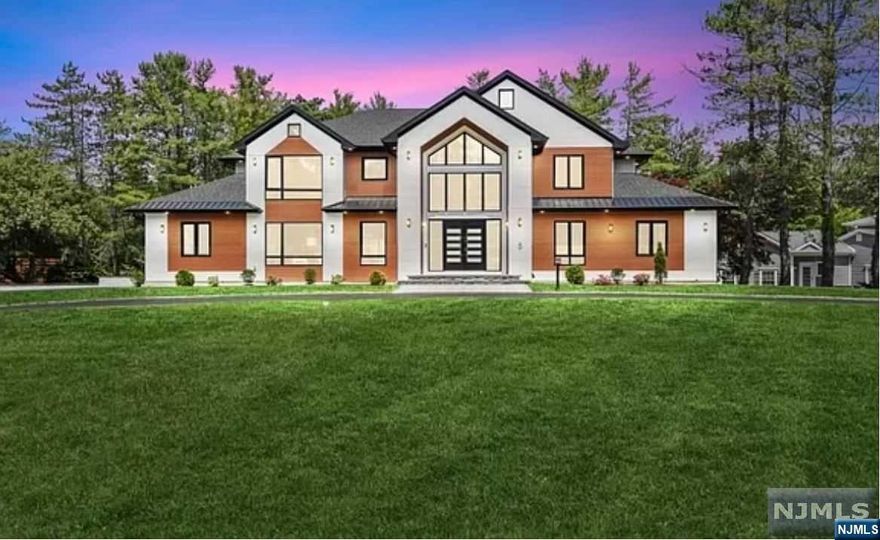 Boasting over 8k sq ft, this modern contemporary is not to be missed. In the sought after Coventry section of Livingston, this Architecturally distinctive 2023 smart home was designed & built by award winning NJGCB, a local design/build firm vetted by NJ Builder Assoc & Forbes Council.On over 3/4 of an acre, enjoy the ultimate indoor/outdoor living as sunlight pours in through the bifold European doors.Chef's kitchen is fully loaded.The formal living room spills into the dining room with a wet bar & fireplace.The home offers 2 master suites, and features 2 walk-in closets and a spa-like bath.5 additional bedrooms, including a 2nd primary suite, are on the upper level. There is a 7th bedroom in the walkout basement with a rec room, gym, media room, and sauna.The deck supports dining & entertaining and the yard is beautifully landscaped. An in-ground pool & spa are the focal points. The patio offers plenty of space for lounging. No expense was spared in the making of this fine home.