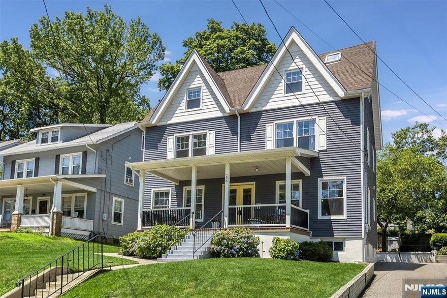 Welcome to this exquisitely updated 5-bedroom, 3.1 bath Colonial ideally located just moments from Brookdale Park, top-rated schools, and the shops and NYC Direct Train at Watchung Plaza. Fully renovated in 2019, this home blends classic charm with modern upgrades throughout. The main level features a sun-filled living room, a spacious dining room perfect for entertaining, and a stylish powder room. The updated kitchen boasts sleek quartz countertops, stainless steel appliances, and modern cabinetry, creating a space that's both functional and elegant. A back entrance leads directly into a convenient mudroom zone, ideal for everyday living. The second floor offers a primary suite with a walk-in closet with a custom shelving systems and beautifully renovated en-suite bath with large shower. Two additional bedrooms and a full bath complete this level. The third floor provides two more bedrooms and a renovated full bath ideal for guests, a home office, or additional family space. The finished basement impresses with high ceilings and flexible space for a rec room or home gym. Nicely proportioned backyard is ideal for outdoor play and entertaining. A small-scale shed offers added storage for tools and seasonal items. Major system updates completed in 2019 include new electrical, plumbing, central HVAC, thermal windows, vinyl siding, and a new asphalt shingle roof. This turnkey home offers timeless style, thoughtful updates, all in a central Montclair location that can't be beat.