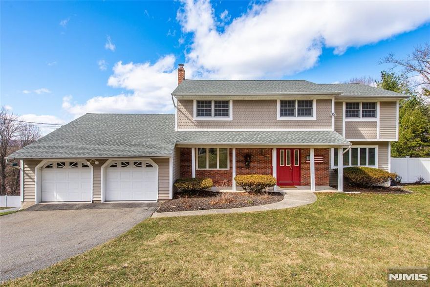 Refined and impeccably updated 4BR, 3.5BA center hall Colonial in sought-after McAtee Estates, offering breathtaking, unobstructed Ramapo Mountain views. Sunlit interiors showcase hardwood floors throughout and radiant heat across the living, dining, and foyer, creating warmth and comfort in every season. The inviting family room is centered around an electric-start gas stove fireplace. A beautifully designed kitchen features a Viking range, double oven, built-in microwave, custom pantry pull-outs, and a movable island for flexible everyday living and entertaining. The serene primary suite offers a walk-in closet and a renovated Jacuzzi shower. The main bath is appointed with durable Brazilian Ipe flooring. Recent upgrades include a newer roof, HVAC, and hot water heater. A whole-house generator ensures uninterrupted living, powering the home and heated in-ground saltwater pool, complete with robotic vacuum. Formal living and dining rooms are enhanced by removable stained glass accents. The full walkout basement with high ceilings and full bath offers exceptional potential for future living space. Additional highlights include a 2-car garage, municipal water and sewer, and natural gas. Ideally located near shopping, dining, and major commuting routes; Wanaque offers full-day kindergarten. A rare opportunityâ€”donâ€™t miss this move-in ready home.