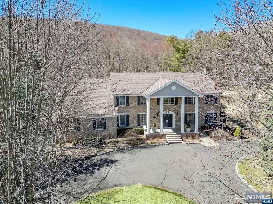 PRIVACY! 2.7 acres sat in the heart of the Ramapo's this elegant center hall colonial offers private lifestyle yet so close to wonderful schools, airports golf and more the POLO CLUB in Mahwah is one of the premier multi-million dollar neighborhoods. Formal living room with fireplace opens up to a two-story great room w fireplace and bar - perfect for entertaining - with wooded views and sliders to pool and cabana. Chefs Salerno Kitchen with Wolf Stove, heating drawers and built in Fridge all with 3rd gas fireplace for intimate dinners. Magnificent 2 story cherry library with room for pool table - makes an grand statement room!! Large primary bedroom with trey ceilings and large tumbled marble bath and Hugh closet with bright, new skylight. Too many amenities to list - all - in the Polo Club of Mahwah set back to Bergen County parkland. A MUST see to appreciate!