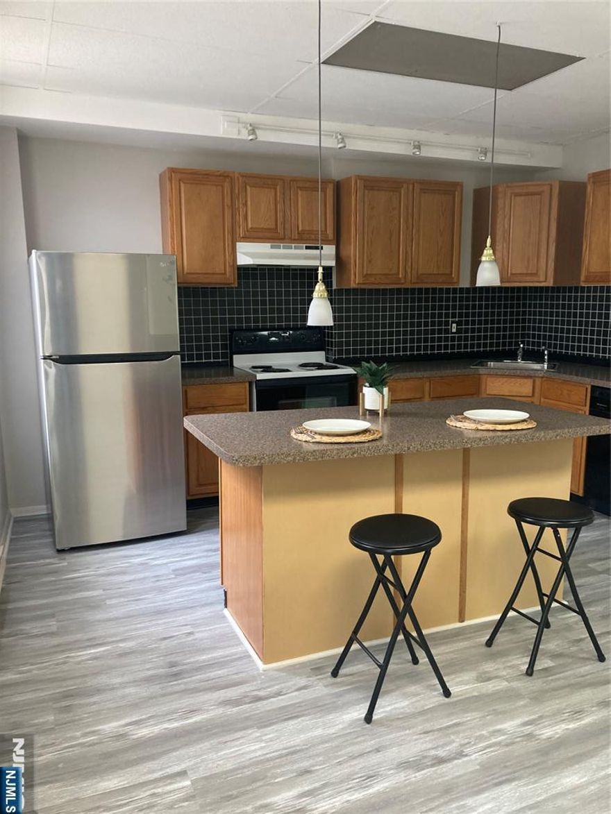 Commuter's dream studio. 600 square feet in the heart of Secaucus. Bus stop at your front door and train just minutes away. Located on the 2nd floor features a fabulous updated modern eat-in-kitchen with a 6 ft island, dishwasher and newer stainless steel refrigerator. There is a large living room/bedroom combination and 1 full bath. Other highlights include 3 ceiling fans, hot water included, window air conditioner. Convenient to restaurants, shopping and banks. No parking. No smoking. No pets.
