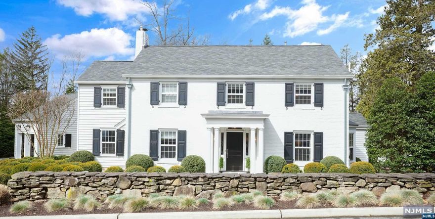 Welcome to a truly special, spectacular home. This impeccable residence sits on approx .6 acre & combines classic architecture with modern sophistication. A stunning custom home that was expanded & designed by renowned McAlpine Home architects. 1st flr boasts a Chef's kit (AGA/SubZero/Viking) w/ custom cabinetry,pantry w/marble counters & dining area. Enjoy the grand LR w/FP, DR w/ beamed ceiling & expansive custom window. The exceptional vaulted fam rm will be hard to leave. Exquisite lib w/ custom cabinetry & sea grass walls,bright office/playroom,relaxing screened-in porch,pwdr rm & mudroom w/ brick floor complete this level. 2nd flr boasts an elegant primary suite w/ 3 closets & true spa 5pc marble bath. 3BRS,2full baths & convenient 2nd floor W/D. Walkout lower level has BR/office,full bth,2nd W/D,playroom & storage. All of this + 4 car garage,gorgeous yard & can walk to town. More features listed on highlight sheet. Every detail has been thoroughly & thoughtfully designed.