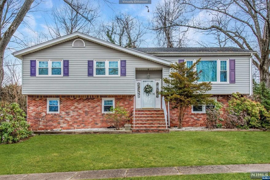 Nestled on a generous corner lot, this 1,980 sq ft bi-level property strikes a harmonious balance between comfort and style, creating a welcoming retreat. Brand-new hardwood floors lead through a traditional layout, offering 4 bedrooms and 2.5 baths for spacious living. The modern kitchen, heart of the home, adjoins a stylish dining area, perfect for casual meals and gatherings. The master suite, with an en suite bathroom, provides a private sanctuary. Elegant touches include panel and base molding, complemented by freshly painted walls. Enjoy year-round comfort with central A/C and forced hot air. Convenience is key with a secure two-car attached garage. Situated on a peaceful dead-end street, relish the tranquility and privacy. This property offers more than a home; it's a practical and well-designed lifestyle, a fusion of modern amenities and timeless design in a tranquil setting.