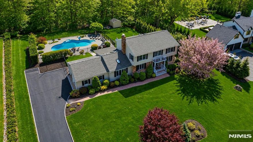 Welcome to 112 Urban Club Rd, a beautifully reimagined Colonial set on nearly an acre of private property. This impressive home offers 4 Bedrooms, 3.1 Baths, a seamless blend of scale, design & function. Grand entry foyer opens to sun-filled living spaces featuring Andersen windows t/o. Show-stopping custom Kitchen is designed to impress, showcasing matte black cafe appliances, dual sinks w/prep station, refrigerated drawers, Caesarstone counters w/full backsplash, walnut shelving & large center island w/breakfast seating. The adjacent formal Dining Rm makes a bold statement w/herringbone wall detail, custom built-ins & designer finishes. A dramatic Great Rm w/soaring ceiling, exposed beams, shiplap accents & a sleek stucco wood-burning fireplace anchors the home. A 4-season Sunroom ideal for office or relaxation offer flexibility. The main level also includes a Mudrm w/built-in, Powder Rm & access to a 2-car garage w/epoxy flrs. Upstairs features wide plank oak flrs, a Primary Suite w/ WIC & en-suite bath, 3 add'l Bedrms & a recently updated main bath w/double vanity. The finished basement w/full Bath adds bonus 1100 sq. ft of living space, while the updated laundry rm has been thoughtfully elevated to include a large folding area & custom shelving. The backyard is a private oasis, an oversized pool, separately gated for added safety, plus multiple entertaining & lounge areas. Smart home features include Wi-Fi lighting & ADT security. A true lifestyle property inside & out.