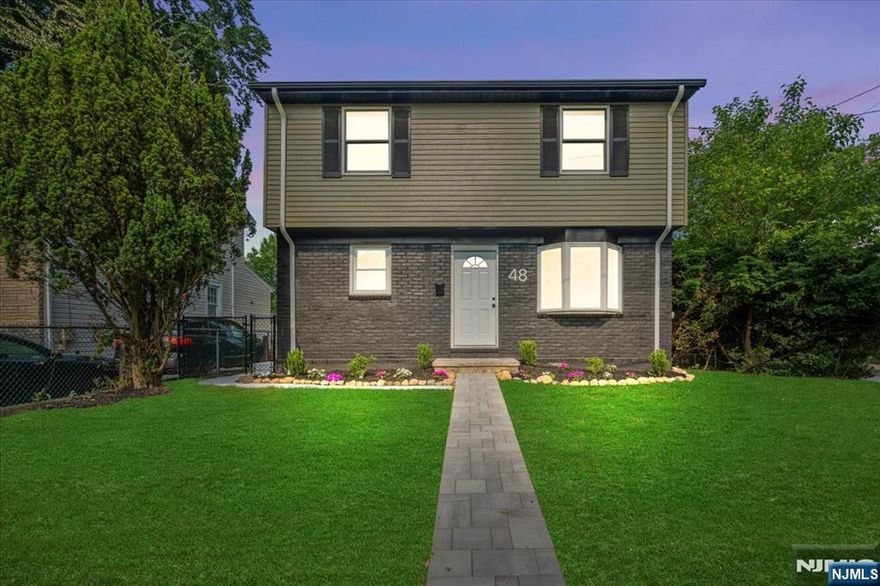 Welcome to this colonial home in the fleetwood section of Dumont! This home features updated kitchen, bathrooms, new 2 zone central air & forced heat, new hot water heater, and has a 200amp electric panel. The first floor has an open concept living room with slider door, beautiful kitchen with quartz countertops, Samsung stainless steel appliances, soft close cabinets, big breakfast bar, dining area, and 1/2 bathroom. Upstairs features 2 bedrooms with an updated bathroom, a massive primary bedroom, with a walk-in closet, to a huge primary bathroom with double vanity and a walk-in shower! Fully Finished basement with laundry room and utility room on one side and finished rec room on the other. Detached one car garage, privacy trees around the yard, walking distance to schools, and transportation.