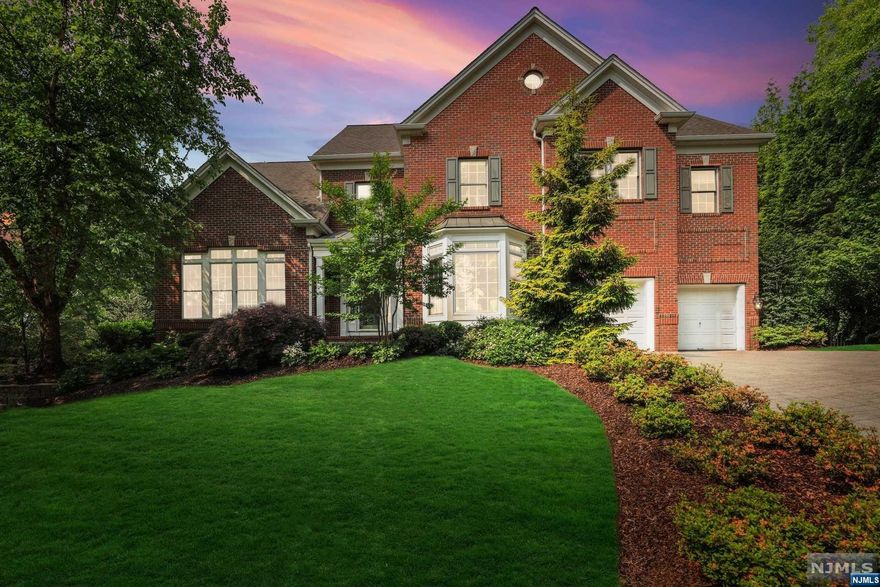 This 20-year young elegant Pulte-built Colonial is nestled on South Mountain & offers stunning views of NYC! Have all the charm of living in SOMA without the hassle of a 100+ yr old home! This light-filled 5 BD/4.1 BA home features vaulted ceilings, large windows, and seamless room flow. The centerpiece is the chef's kitchen with large center island and adjoining two-story family room. The breakfast area redefines casual dining. The adjoining family room w/ fireplace, is a welcoming hub. The 1st fl also features a butler's pantry, office, powder room, laundry room, mudroom and tons of storage. There is access to the oversized 2-car attached garage w/ bonus workspace. On the 2nd fl are 4 well appointed bedrooms - all w/ custom walk-in closets. The primary suite features a tray ceiling, large windows, two walk-in custom closets, en-suite bathroom w/ an oversized shower, soaking tub, and double vanity. Shower while looking at the skyline of NYC!