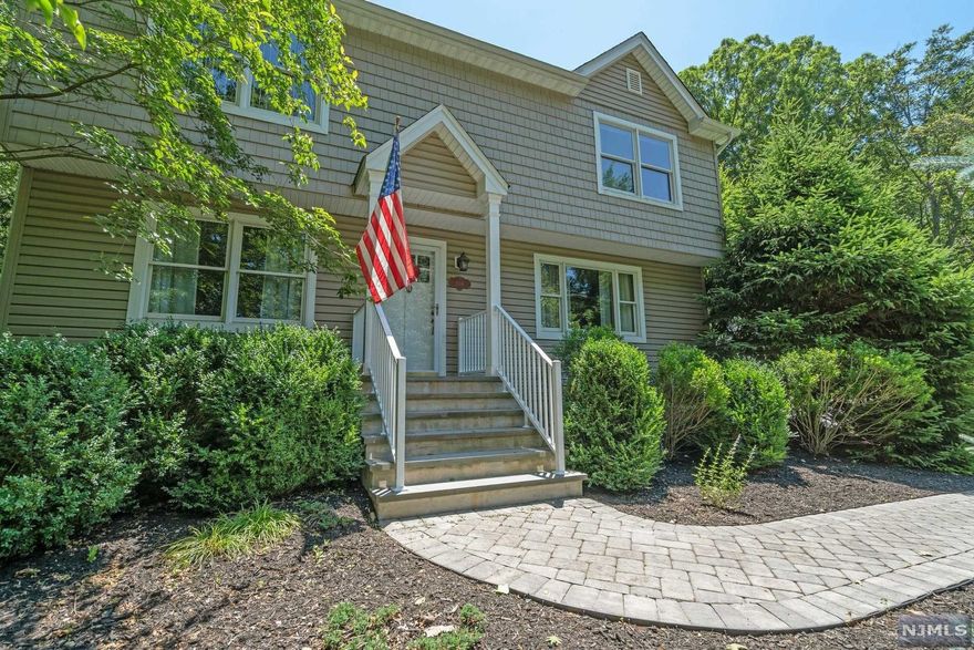 Welcome home to your own private retreat in Fardale. This Colonial style home was once a cape and was expanded about 10 years ago to fit today's lifestyle. The large kitchen is open to the family room with a fireplace and windows facing the private rear yard with a heated gunite swimming pool, changing room, patio with grill, and hot tub. You will feel like you're on vacation in this oasis surrounded by 35 ft green giants for ultimate privacy. The laundry is conveniently on the main level near the full bath ideal for guests coming in from the pool. The master suite offers 2 walk in closets with his/hers bathrooms. There is an unfinished walk up bonus room of 450 sq ft which is a clean slate for a home office, bedrooms, playroom, etc. Neighboring homes up the road are selling for over $1M. Seller can offer a flexible closing. Mahwah offers extremely low taxes, award winning schools, proximity to hiking, skiing, natural lakes, and much more.