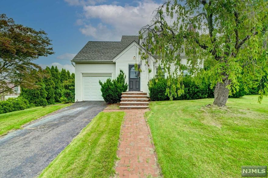 Great opportunity to invest in or own this traditional Cape in the lovely suburb of Hasbrouck Heights. Enter into the sizable LR w/ its timeless hardwood floors, large windows that let in plenty of natural light & original fireplace w/ intricate molding. The LR flows naturally into the traditional DR & then on into the sunny Kitchen w/ plenty of storage & prep space. For maximum convenience, a large tiled Mudroom sits steps from the Kitchen & ft/ thoughtful cabinetry, French door onto the brick patio & Garage access. The upstairs living area ft/ a full Bath & 3 sizable BRs w/ built-in storage & hardwood floors throughout. Even more convenient storage can be found in the Basement w/ several walls of built-ins plus a possible Workspace/Office area, as well as a dedicated Laundry area. Outside, the back patio beckons you to sit and relax among the flowering gardens & sizable property. Experience the best of Bergen County living only 20 mins from NYC!