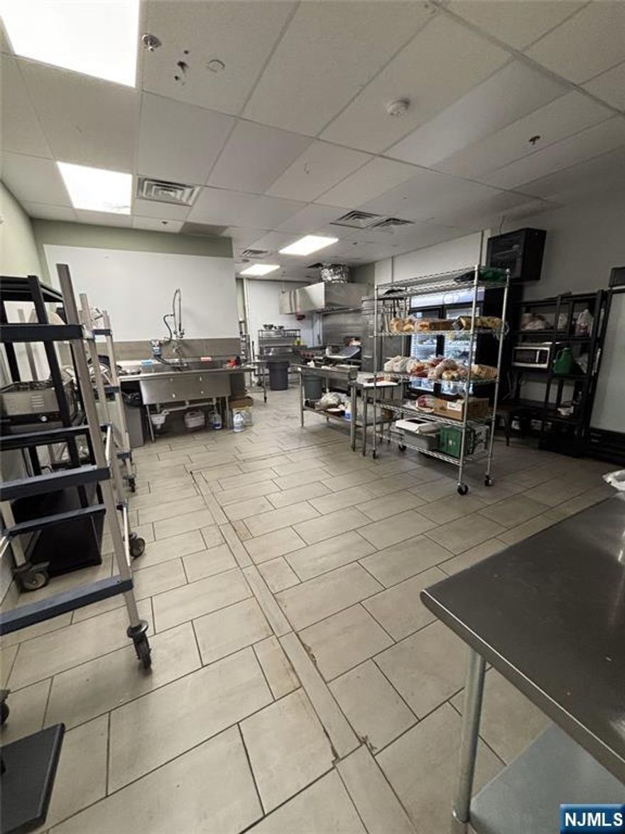 A well-established juice bar and cafe located in Wayne, New Jersey, in a high-traffic area. The commercial property is equipped with all the necessary fixtures and appliances to continue operating as a juice bar or be easily transformed into another food service concept. While the space is currently a juice bar, it is suitable for a variety of food industries, excluding Mediterranean and Chinese cuisines. This is an excellent opportunity for entrepreneurs looking to take over a turnkey business or start a new venture in a prime location.