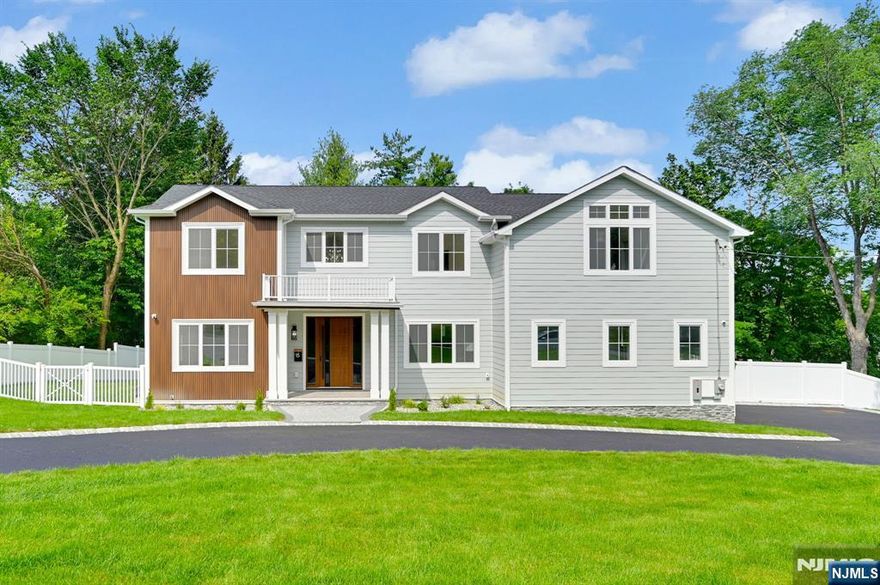 Welcome to this stunning 6 Bedroom, 5 full and 2 half Bathroom, NEW CONSTRUCTION Center Hall Colonial Home with Circular Driveway situated on a sprawling .51-acre lot in a great neighborhood, boasting approx 5,000 sq ft of luxurious living space across 3 floors with FENCED Backyard. As you enter through the grand double-height lobby, you are greeted by the exquisite formal living room on one side & formal dining room on the other. The eat-in kitchen features custom cabinets, high end appliances, quartz countertops and seamlessly flows into the Family room with inviting fireplace & sliders that open to an oversized deck, ideal for entertaining & enjoying views of the backyard. The 1st floor is designed with convenience in mind, featuring a spacious bedroom ensuite and separate powder room. The 2nd floor features four generously sized bedrooms including the luxurious Primary Suite serving as a private retreat, offering a spa-like bathroom & 3 walk-in closets. One Junior ensuite, while 2 other bedrooms are serviced by a shared bath w/ dual vanity. A convenient laundry room w/ Sink completes this floor. The finished basement is perfect for entertainment & relaxation, featuring a generous recreation/game room, a private bedroom ensuite, additional bedroom/office space, 2nd powder room & storage. A 2-car garage with wide driveway ensures ample space for vehicles. Perfectly located, this home is close to top rated Schools, NYC Transportation, shopping & Major Highways.